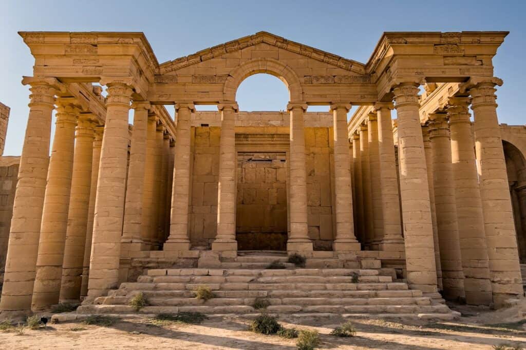 Ruins of the ancient city of Hatra in Iraq, a UNESCO World Heritage archaeological site featuring massive stone walls and temples from the Parthian period, located in the Mesopotamian desert