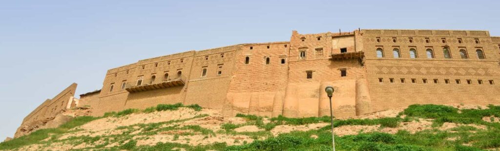 Ancient Erbil Citadel rising above the city in Iraqi Kurdistan, one of the oldest continuously inhabited settlements in the world and a major historical landmark for travelers visiting Iraq.