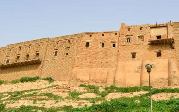 Ancient Erbil Citadel rising above the city in Iraqi Kurdistan, one of the oldest continuously inhabited settlements in the world and a major historical landmark for travelers visiting Iraq.