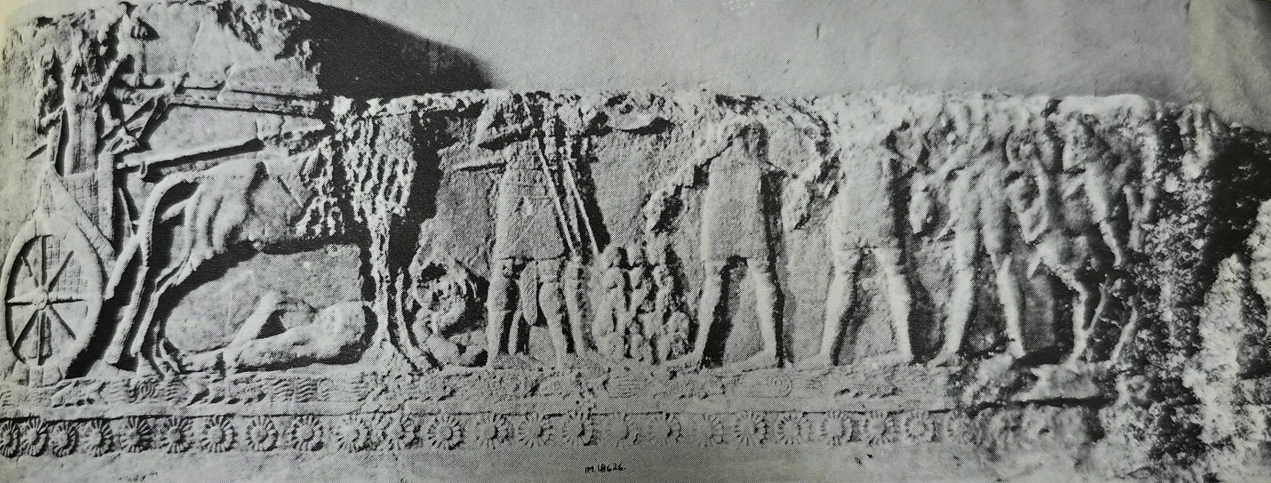 Large Assyrian relief from Khorsabad depicting a war scene with the king in his chariot, showcasing the power of the Assyrian Empire