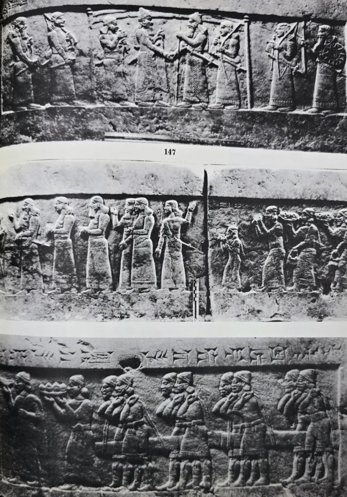 Throne-Dais of Shalmaneser III (858-824 B.C.) consists of two large slab of yellowish limestone decorated with three scenes in bas-relief depicting 84 persons. Its surface and sides are carved with writings mentioning the name of this king, his titles, deeds and conquests. Found at Nimrud.