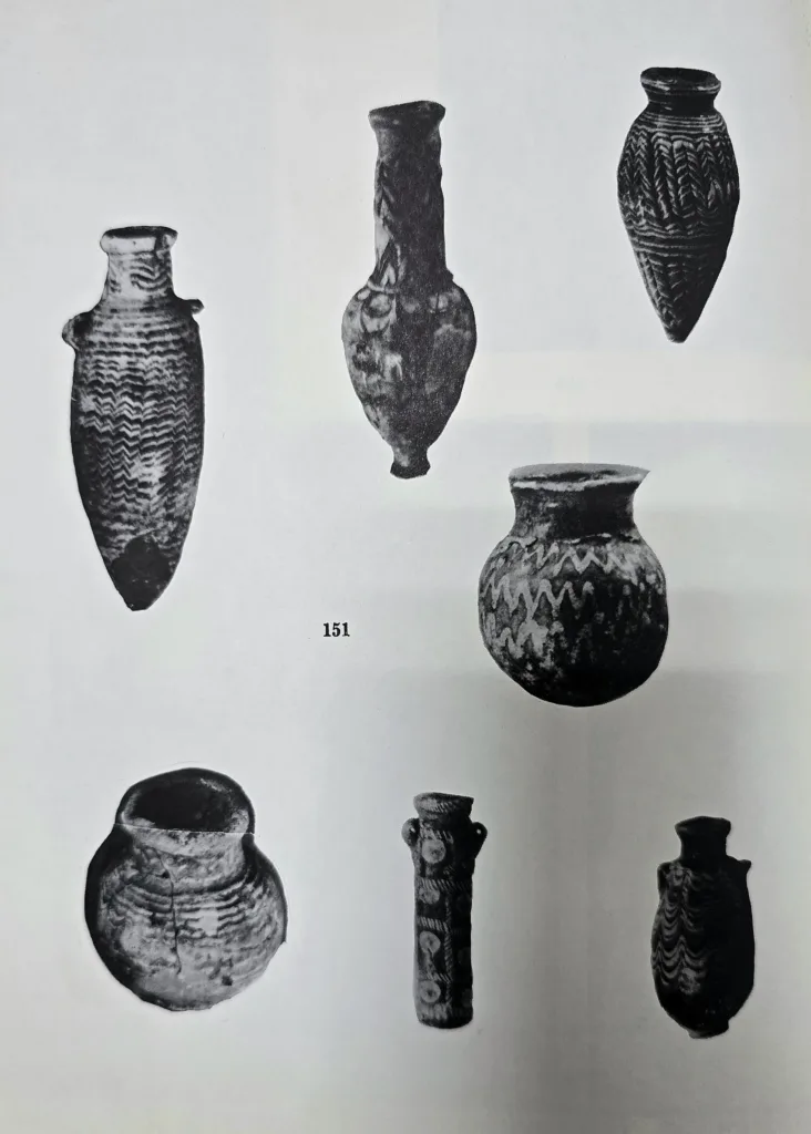 A collection of flasks in glazed frit, found at Nineveh, Ashur and other sites