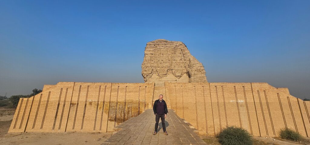 Visitors exploring an ancient ziggurat it on private tours to Iraq