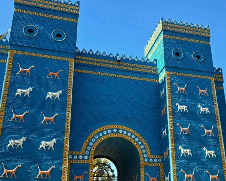 The reconstructed Ishtar Gate of ancient Babylon, one of Iraq’s most iconic archaeological sites featuring vivid glazed brickwork and lion reliefs, commonly included in cultural and historical journeys through Iraq such as Iraq group tours exploring Mesopotamian civilization.