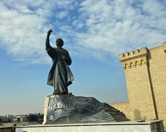 The Al-Mutanabi Statue in Baghdad’s famous Al-Mutanabbi Street, a cultural landmark often included in Iraq group tours and Iraq small group tours, showcasing the literary heritage and historic atmosphere of central Baghdad.