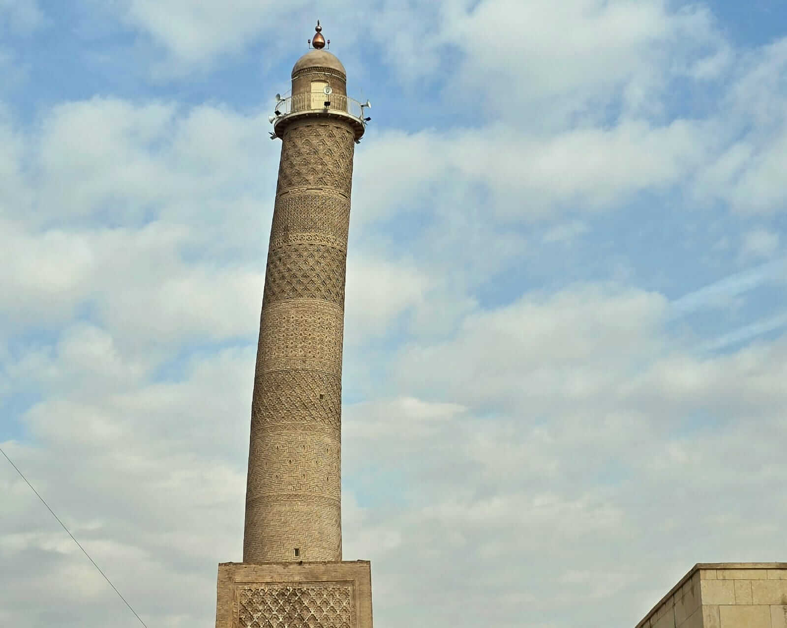 The Leaning Minaret of Mosul (Al-Hadba), a historic landmark in northern Iraq’s old city, representing the city’s rich Islamic architecture and heritage, often featured on group tours in Iraq exploring major cultural and historical sites.