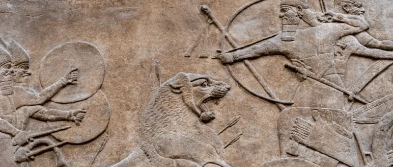 Close-up of an ancient stone relief in Iraq, showing intricate carved details and preserved artistic features that reflect the craftsmanship and cultural heritage of ancient Mesopotamian civilizations