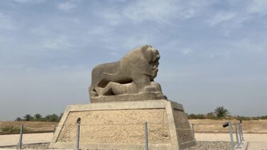 The Lion of Babylon, an ancient basalt statue standing at the archaeological site of Babylon, Iraq, symbolizing the power of the Babylonian Empire.