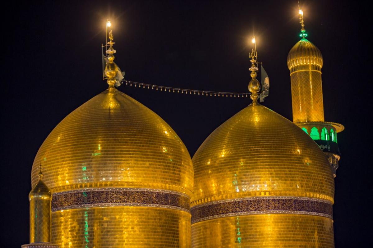 The magnificent golden domes and elegant minarets of the Imam Al-Kadhim Holy Shrine in Baghdad, Iraq, showcasing its remarkable Islamic architecture.