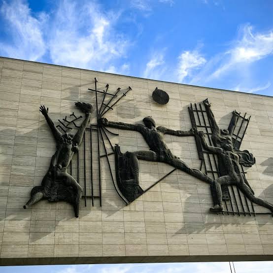 Close-up view of the Freedom Monument at Liberation Square (Tahrir Square) in Baghdad, Iraq, highlighting the detailed bronze sculptures by Jawad Saleem.