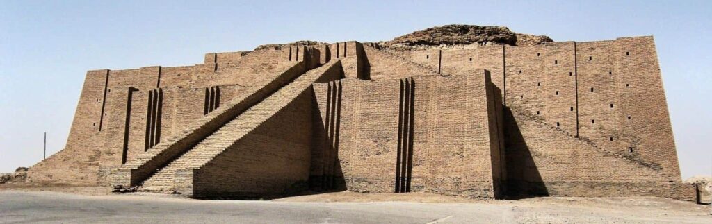 The monumental Ziggurat of Ur rising from the ancient archaeological landscape of southern Iraq, showcasing the massive stepped structure built by the Sumerians and visited on the 4-Day Iraq Civilization Tour.