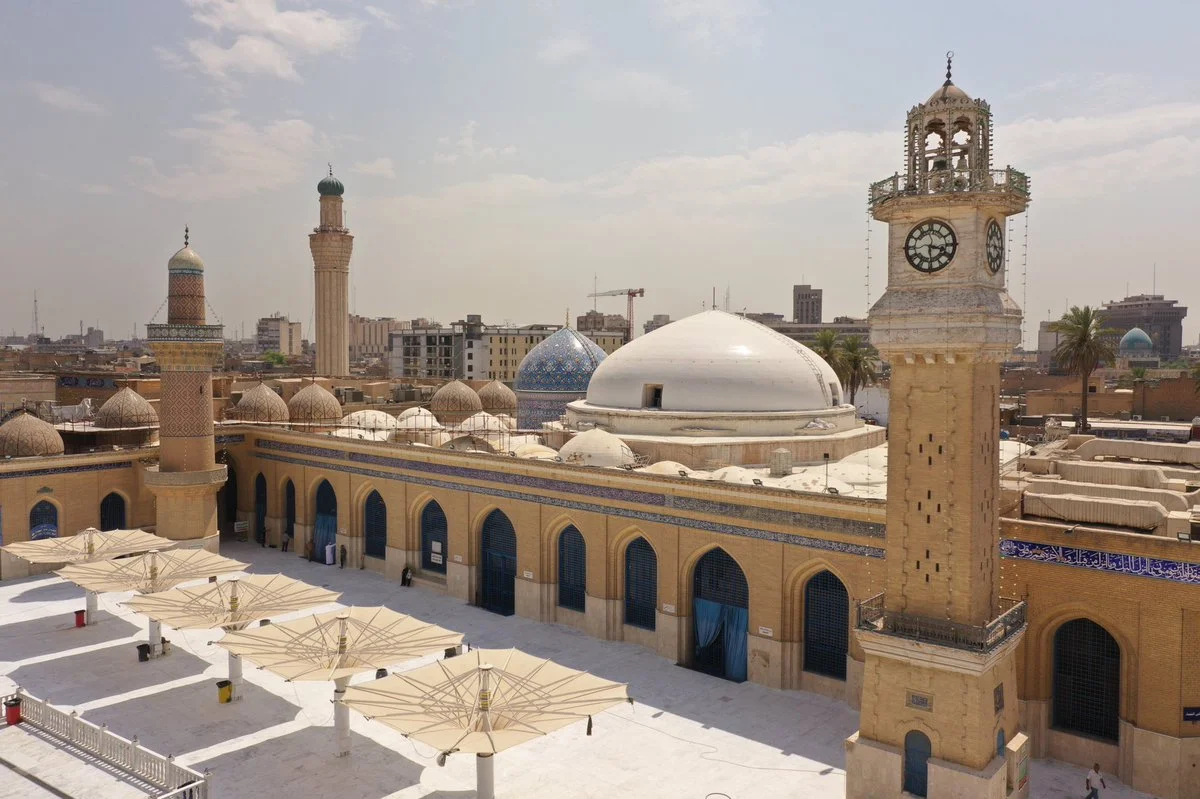 Shrine of Abdul Qadir Al-Gilani in Baghdad, Iraq, featuring its distinctive Islamic architecture, ornate golden dome, and peaceful courtyard, a significant historic and spiritual landmark in the heart of the city.
