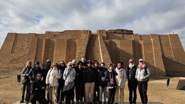 Tourist standing in front of the ancient Ziggurat of Ur during the 5-Day Iraq Cultural Discovery Tour, exploring one of Iraq's most important Sumerian archaeological sites in southern Mesopotamia