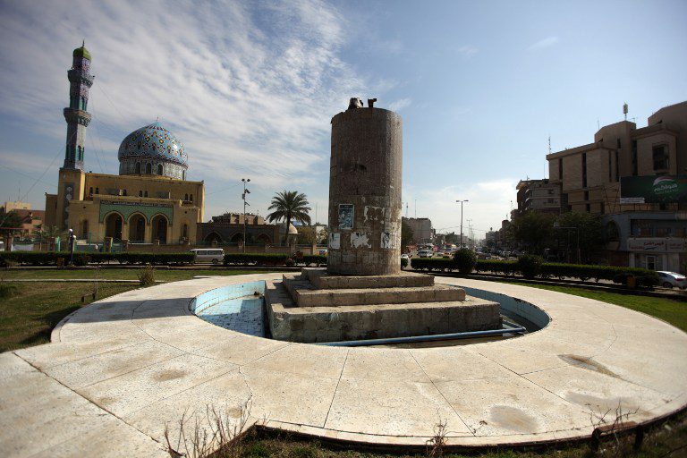 Al-Firdos Square in central Baghdad, Iraq, showing the busy urban surroundings and streets of one of the city's well-known public spaces, situated in the heart of the Iraqi capital.