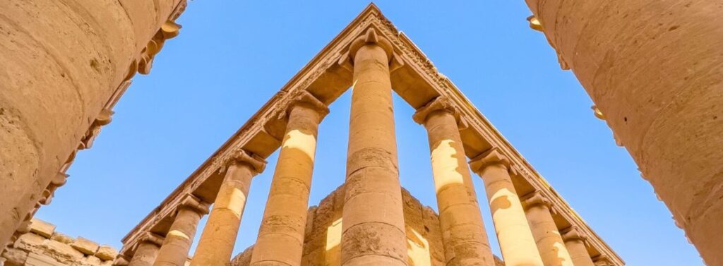 Close-up view of the ancient city of Hatra in northern Iraq, showing the monumental stone ruins, classical columns, arches, and detailed architectural remains of this historic Mesopotamian city