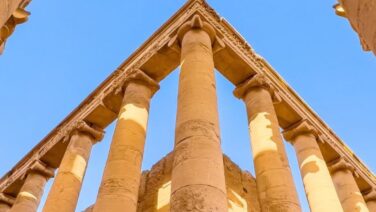 Close-up view of the ancient city of Hatra in northern Iraq, showing the monumental stone ruins, classical columns, arches, and detailed architectural remains of this historic Mesopotamian city