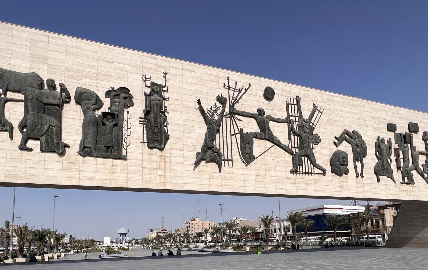View of Liberation Square, also known as Tahrir Square, in central Baghdad, Iraq, highlighting the surrounding cityscape and the historic Freedom Monument featured during the 3-Day Baghdad Iraq Tour.
