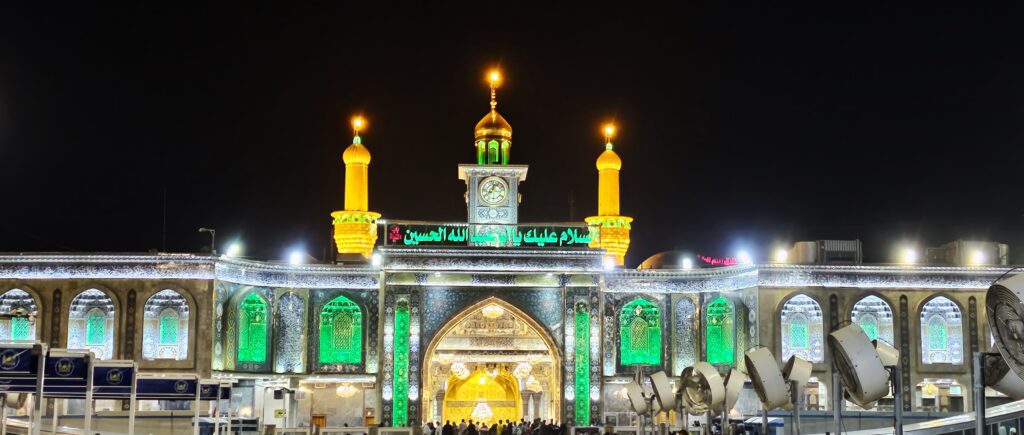Imam Hussein Holy Shrine in Karbala, Iraq, featuring its magnificent golden dome, towering golden minarets, and ornate Islamic architecture.